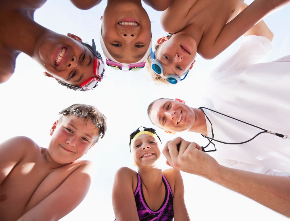 Swim team in a huddle